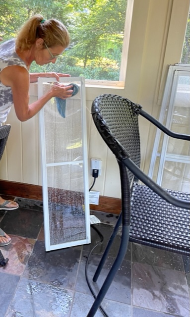 image shows vinyl sunroom window being cleaning 